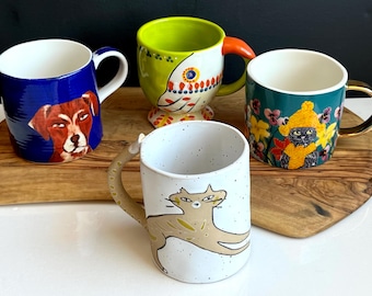 Assortment Anthropologie Mugs- Francesca Kaye Garden Cat, Carol Atkins “Duke” Dog, Tortua Bird, Kiki the Cat -all like new condition