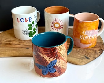 Assortment Anthropologie Mugs- Jen Peters “Kindness”,Nature Studies “Butterfly”, “Le Soleil” Hotel Magique, “Love and Magique” Hotel Magique