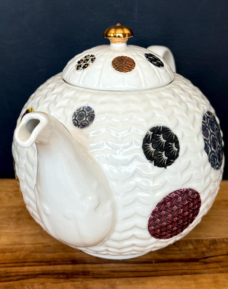 May include: A set of three ceramic vases in varying heights. The vases are white with a textured, ribbed design. The tallest vase is approximately 10 inches tall, the medium vase is 8 inches, and the smallest is 6 inches.