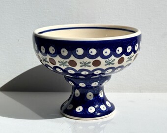 Polish pottery footed dessert bowl with classic blue-and-white "mosquito" eye pattern and delicate green dragonfly accents 5” wide x 4” tall