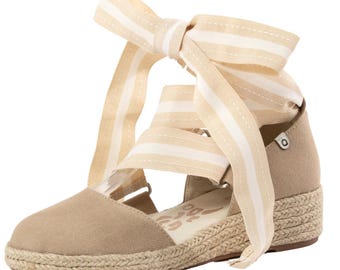 The Elaine Too Espadrille.  1.5" wedge espadrille sandal with grosgrain ribbon tie.