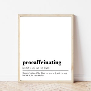 May include: A framed print with the word "procaffeinating" in a bold, black font. Below the word is the phonetic pronunciation and definition: "the act of putting off the things you need to do until you have had one to five cups of coffee."
