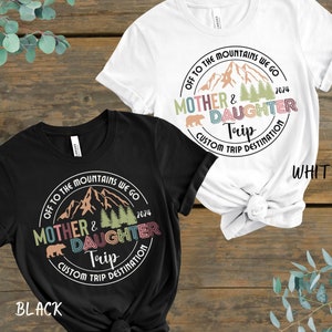 Mother and daughter trip shirts adorned with a mountain scene, personalized with trip destination.