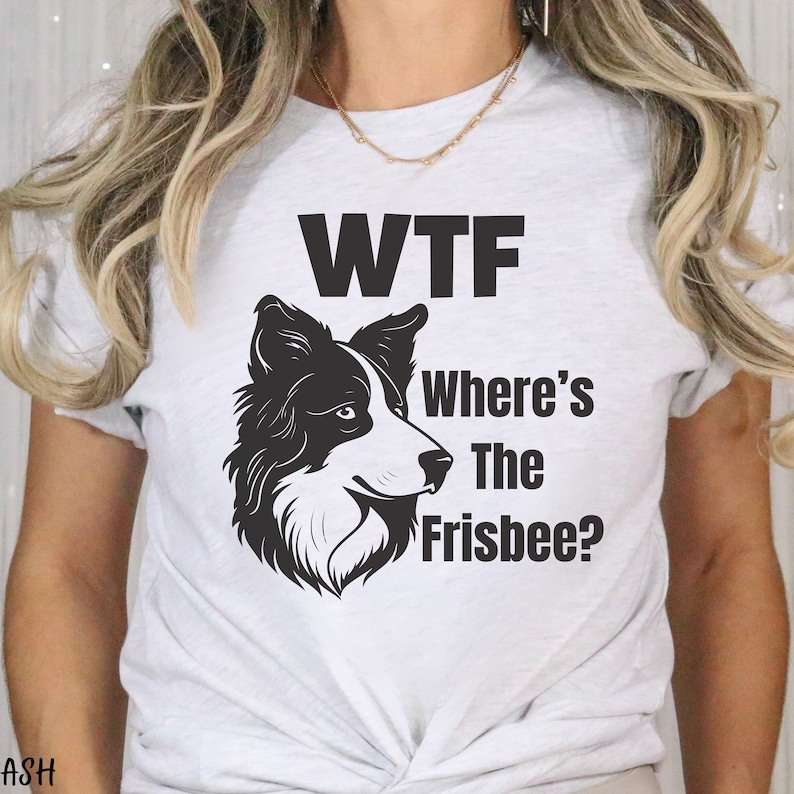 May include: White t-shirt with a black and white border collie dog illustration and the text "WTF Where's The Frisbee?"