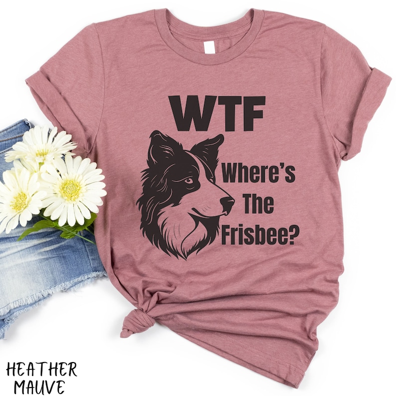 May include: A heather mauve t-shirt with a black silhouette of a border collie dog and the text "WTF Where's The Frisbee?"