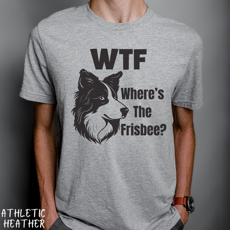 May include: A gray t-shirt with a black and white illustration of a border collie dog. The text "WTF Where's The Frisbee?" is printed on the shirt.