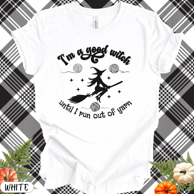 May include: White t-shirt with a black graphic of a witch on a broomstick, surrounded by yarn balls and stars. The text reads "I'm a good witch until I run out of yarn."