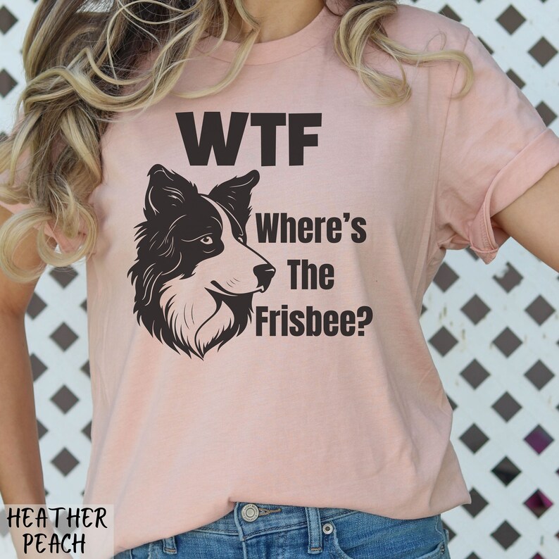 May include: A pink t-shirt with a black and white border collie dog illustration and the text "WTF Where's The Frisbee?"