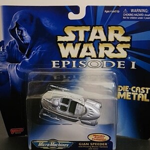 May include: A Star Wars Episode I Micro Machines die-cast metal toy of a GIAN SPEEDER. The packaging is blue with an image of a character holding a lightsaber. The toy has movable action features.