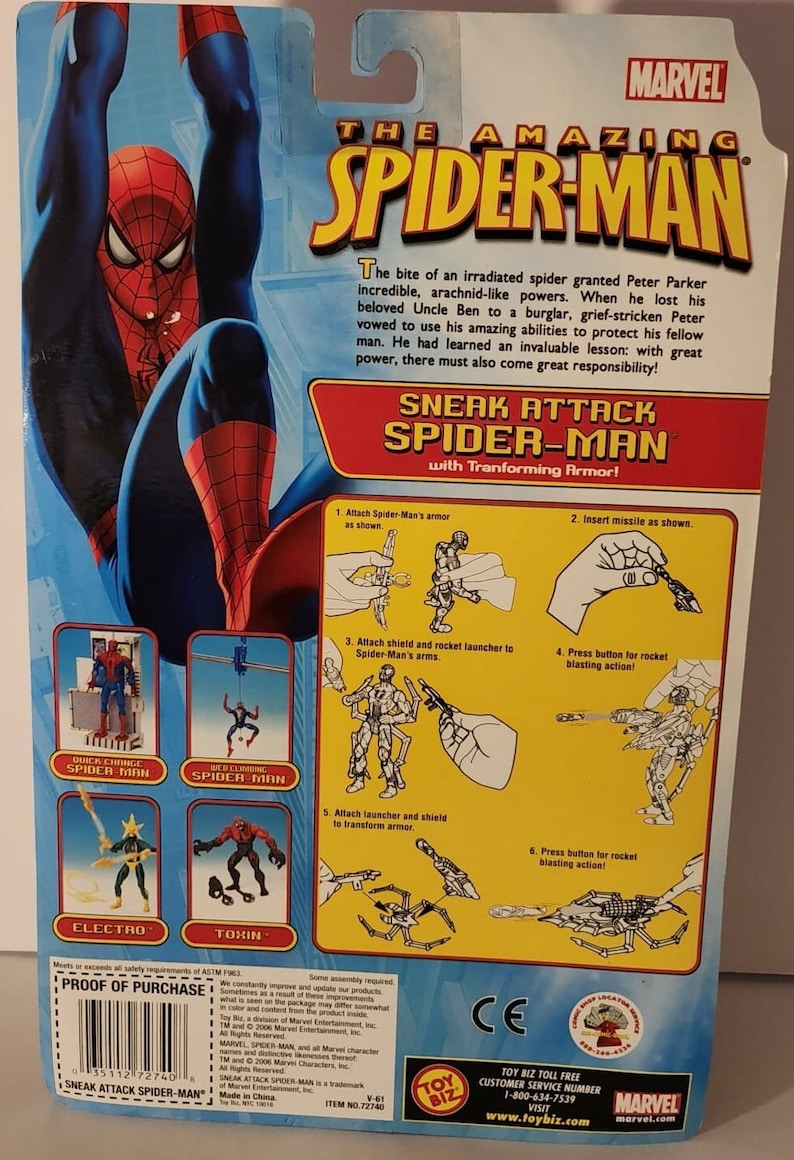 May include: The Amazing Spider-Man action figure with transforming armour. The figure is red and blue with a black spider symbol on the chest. The figure comes with a shield, rocket launcher, and missile. The packaging shows instructions on how to assemble the armour. The packaging also features other Spider-Man characters, including Electro and Toxin.