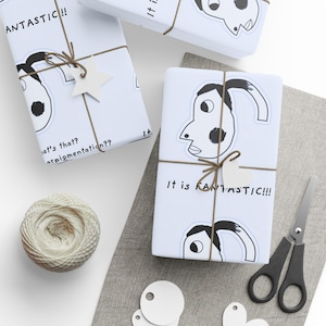 May include: Three white gift boxes wrapped with black and white illustrations of faces. The boxes are tied with brown twine and have tags with the text "It is FANTASTIC!!" and "FANTASTIC!!".