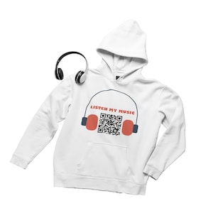 May include: White hoodie with a front pocket and a hood. The hoodie features a graphic of headphones with the text "LISTEN MY MUSIC" and a QR code. A pair of black headphones rests on the hoodie.