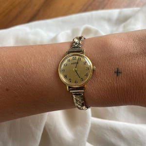 Vintage 1970s Chic Wind Up Rolled Gold Plated Round Dial Ladies Dress Cocktail Wristwatch With Dainty Gold Stretchy Strap By Roamer