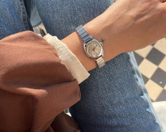 Vintage Ladies 1970s Wind Up Silver St. Steel  Stretchy Strap Round Dial Everyday Wristwatch By Timex