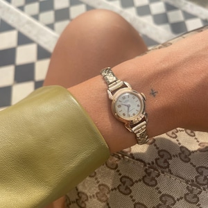 Vintage 1960s Swiss Made 17 Jewels Wind Up Round Dial Ladies Everyday Cocktail Wristwatch With Gold Plated Stretchy Bracelet Strap By Roamer