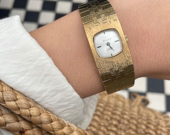 Vintage 1970s Manual Wind Up Square / Rounded Dial Gold Plated Brushed Gold Strap Ladies Cocktail Dress Wristwatch By  Gillex.