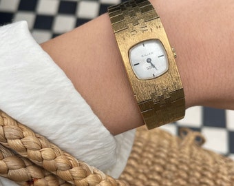 Vintage 1970s Manual Wind Up Square / Rounded Dial Gold Plated Brushed Gold Strap Ladies Cocktail Dress Wristwatch By  Gillex.