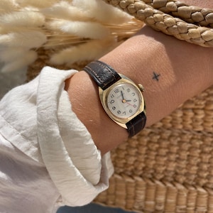 Vintage 1970s USSR Gold Tone Round Bezel Manual Wind Up Dark Brown Leather Strap Ladies Everyday Wristwatch By Sekonda