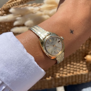 Vintage Japanese Gold Plated Steel Link Strap Round Gold Dial Automatic Wind Up Ladies Everyday Wristwatch With Day / Date Dial By Seiko
