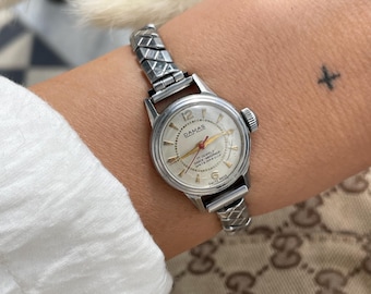 Vintage Ladies Swiss Made 1970s Wind Up 17 Jewels Silver St. Steel Waterproof Round Case & Stretchy Strap Round Dial Wristwatch By Damas