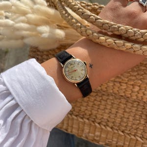 Rare Beautiful Vintage 1950s Round Gold Plated Bezel Manual Hand Wind Up Black Leather Strap Ladies Everyday Wristwatch By Nivada