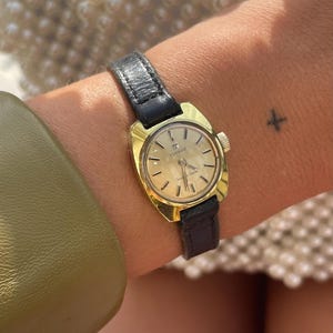 Rare Vintage 1970s Gold Plated Manual Wind Up Black Leather Strap Ladies Small Dainty Everyday Dress Wristwatch By Tissot Seastar Seven