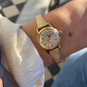 Vintage 1950s/60s Manual Mechanical Wind Up Shockproof Round Dial Gold Plated Stretchy Strap Ladies DaintyWristwatch By Delbana