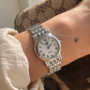 Vintage 2000s Quartz Round Dial With Stainless Steel Link Strap Ladies Dress Wristwatch By Raymond Weil Geneve Toccata With Date Subdial