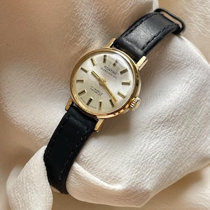 Vintage 1970s Swiss Made Gold Plated Bezel Manual Wind Up Black Leather Strap Ladies Everyday Elegant Dress Wristwatch By Montine