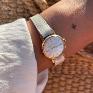 Vintage 1970s Swiss Made Gold Plated Bezel Manual Wind Up White Leather Strap Ladies Everyday Elegant Dress Wristwatch By Montine