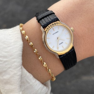 Vintage 1990s Quartz Silver & Gold Tone Bezel Round Face With Patent Genuine Leather Strap Ladies Dress Wristwatch By Stubbs