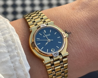 Impresionante reloj de pulsera Gucci vintage de los años 90, chapado en oro 9200L, con correa de eslabones y esfera negra, para mujer, en excelente estado.