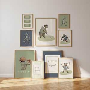 May include: A collection of framed art prints featuring animal illustrations in various sports. The prints include a bear playing golf, a tiger skateboarding, and a bear playing baseball. The color palette includes greens, blues, and beige.