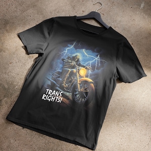 Trans Rights Skeleton Riding A Motorcycle Through Lightning T-Shirt