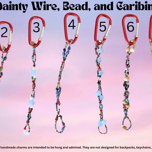 May include: Eight numbered charms featuring red carabiners attached to wire strands decorated with various colourful beads. The text 'Delicate & Dainty Wire, Bead, and Caribiner Charms' appears at the top, with a warning at the bottom.