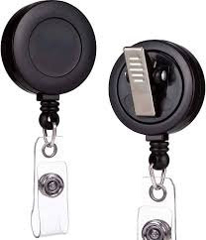 May include: Two black retractable badge holders with a silver clip and a clear plastic badge holder. Each holder has a black chain and a silver ring.
