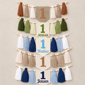 May include: Five pennant banners featuring the number 1, each strung with wooden beads and yarn tassels in various colors. The banners display the names JOSIAH, WALKER, and JENSEN in different colored fonts, while two banners show only the number 1.