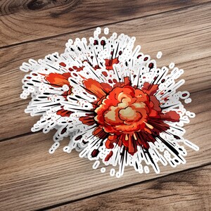 May include: A vibrant explosion sticker featuring a dynamic, cartoonish style. The explosion is predominantly orange and red, with black lines radiating outwards, creating a sense of motion and energy.  The design is detailed, with varying shades of color and texture suggesting smoke and fire. The sticker is ideal for adding a dramatic, comic-book effect to any surface.