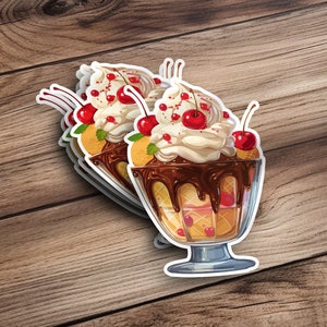 May include: Sticker sheet featuring three illustrated ice cream sundaes. Each sundae is in a clear glass dish, topped with whipped cream, chocolate sauce, cherries, and waffle cone pieces. The sundaes are rendered in a vibrant, realistic style with rich brown, creamy white, and deep red colors. The stickers are perfect for adding a sweet touch to laptops, water bottles, or planners.
