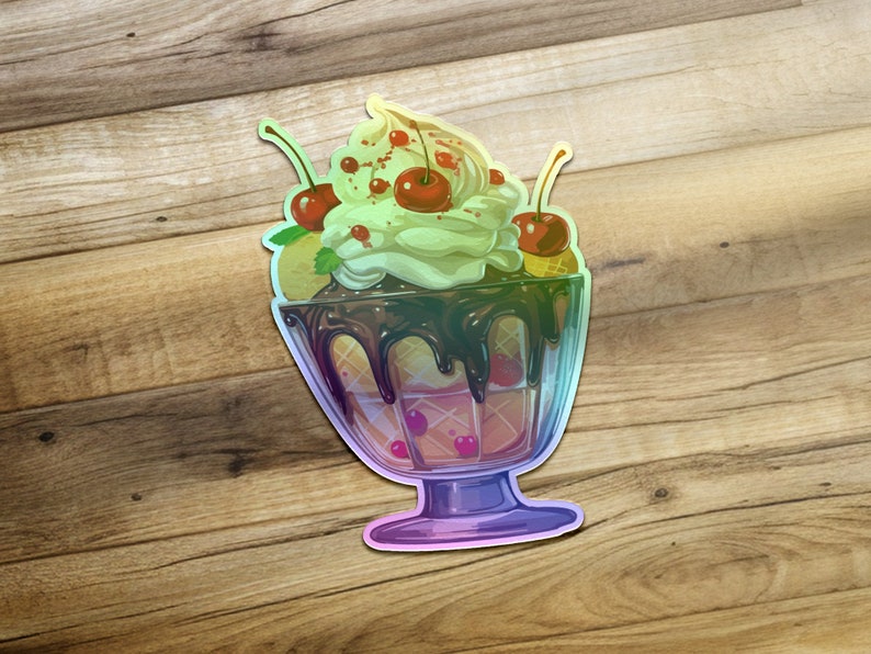 May include: A vibrant, iridescent sticker depicting a delectable sundae. The sundae is served in a clear glass dish, showcasing layers of creamy vanilla ice cream, chocolate sauce, and waffle cone pieces.  Three bright red cherries garnish the top, adding a pop of color against the light green ice cream. The sticker features a glossy, almost holographic effect, giving it a three-dimensional appearance. The overall design is whimsical and appealing, perfect for ice cream lovers and dessert enthusiasts.
