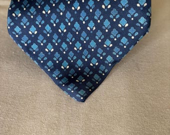 Vintage Yves St Laurent Navy Blue Tie with light blue flowers and cream accents.