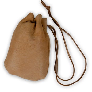 May include: A small, brown leather pouch with a drawstring closure and a long leather strap.