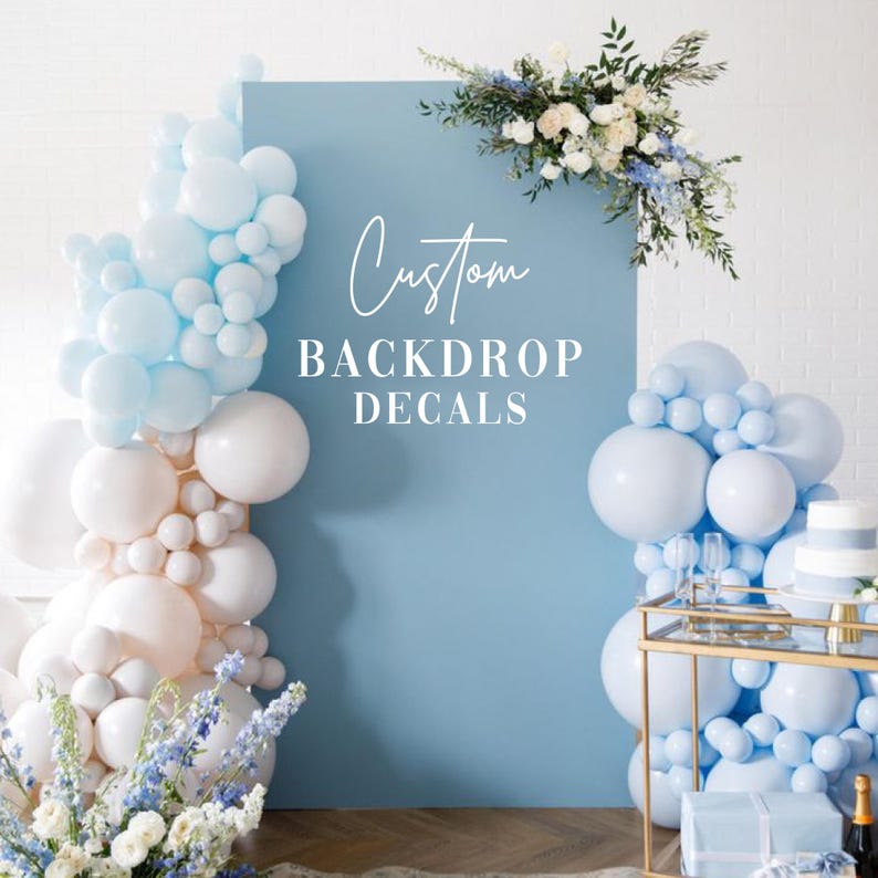 Custom vinyl backdrop decal featuring personalized text in a modern script font. Designed for weddings, birthdays, and special events. Shown applied to a solid wall for a clean, professional look. Ideal for use behind dessert tables, photo booths, or ceremony spaces. Available in various sizes and colors to match your theme. Easy to apply and made for temporary or semi-permanent use. Perfect for adding a personal touch to any celebration.