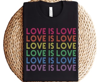 May include: Black t-shirt with the phrase "LOVE IS LOVE" repeated six times in rainbow colors.