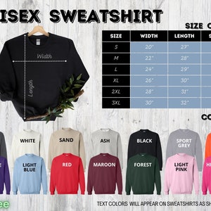 May include: Black unisex sweatshirt hanging on a wooden hanger. The image includes a size chart with measurements in inches and a color palette with options like dark heather, white, and red. Text on the image reads "UNISEX SWEATSHIRT".