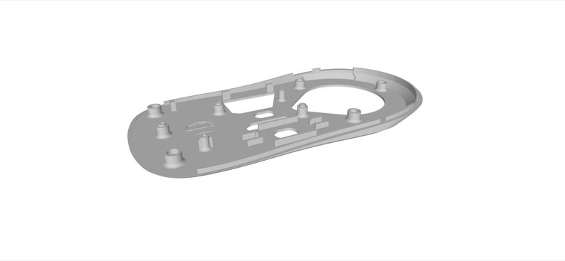 May include: A gray plastic mouse shell with a circular cutout for the sensor and several small holes for screws.