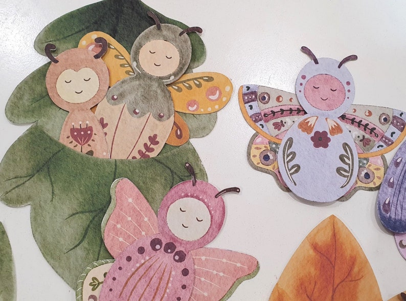 May include: A set of five colorful paper butterflies with intricate designs. The butterflies are decorated with flowers, leaves, and dots. They are perfect for adding a touch of whimsy to any craft project.