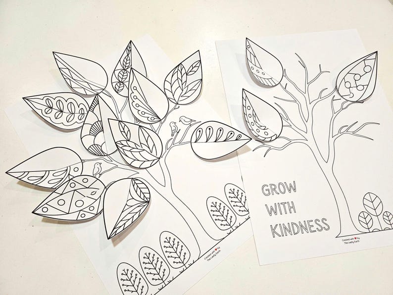 May include: Two white paper tree illustrations with black outlines and detailed leaf designs. One tree has 3D leaves. The text "GROW WITH KINDNESS" is on one of the papers. The image is suitable for coloring.