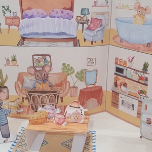 May include: A pop-up paper dollhouse with a living room, bedroom, kitchen, and bathroom. The house is decorated with furniture, plants, and a mouse family. The house is made of cardboard and is designed to be assembled and played with.