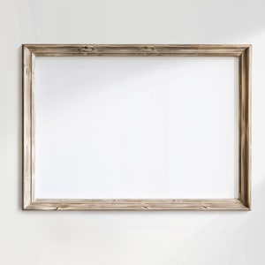 Op de afbeelding: Een eenvoudige, rechthoekige houten fotolijst met een lichtbruine afwerking. De lijst is leeg en klaar om te worden gevuld met een foto of kunstwerk.